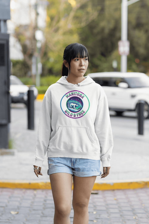 Embrace the power and beauty of the north with our Manitoba – Wild & Free hoodie, featuring a bold graphic of a polar bear beneath the awe-inspiring northern lights.